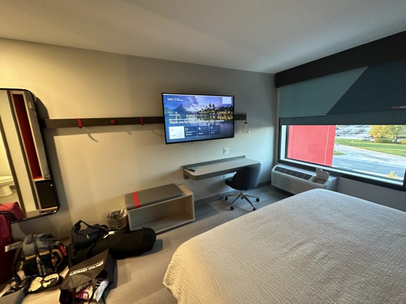 a room with a bed and a tv