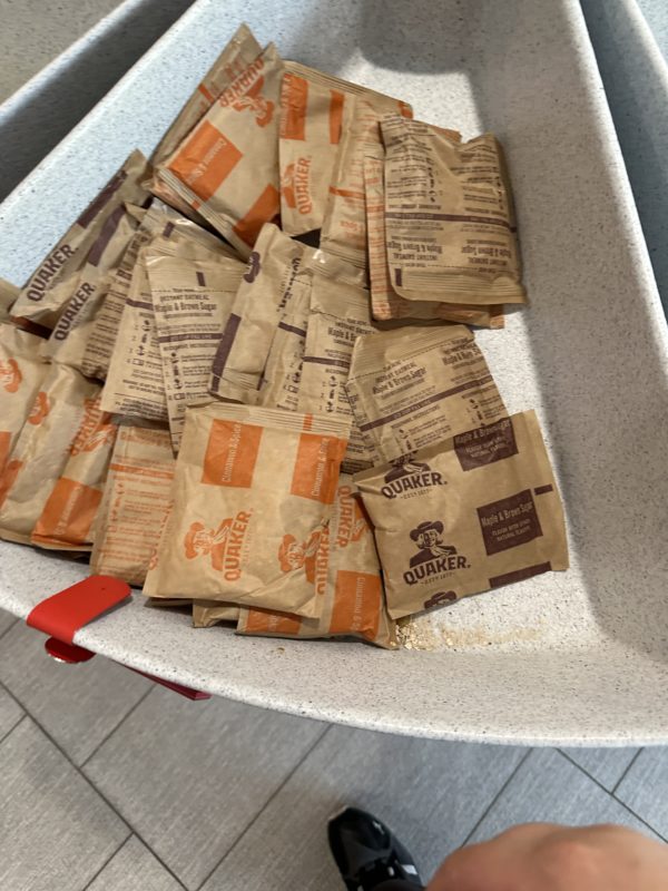 a group of brown packets in a white container