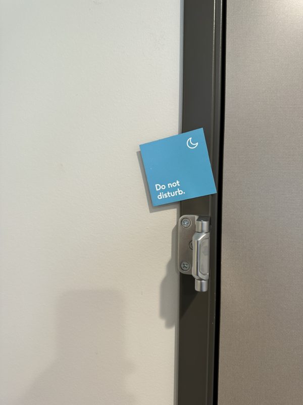 a door handle with a sign