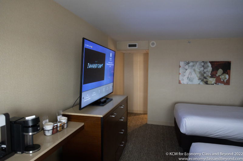 a tv on a dresser in a hotel room