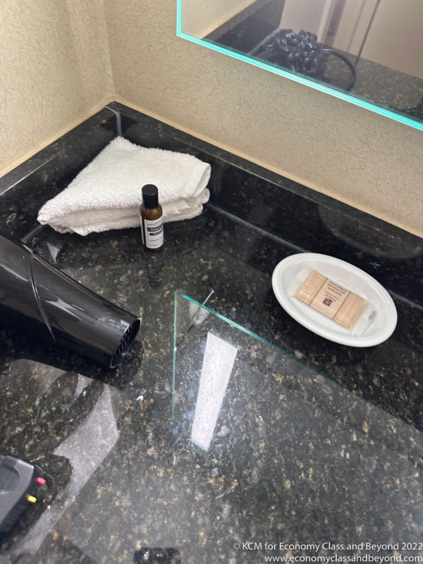 a towel and soap on a counter