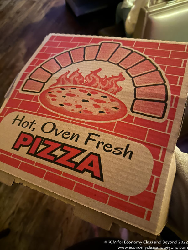 a pizza box with a pizza in the oven
