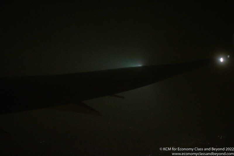 a wing of an airplane at night