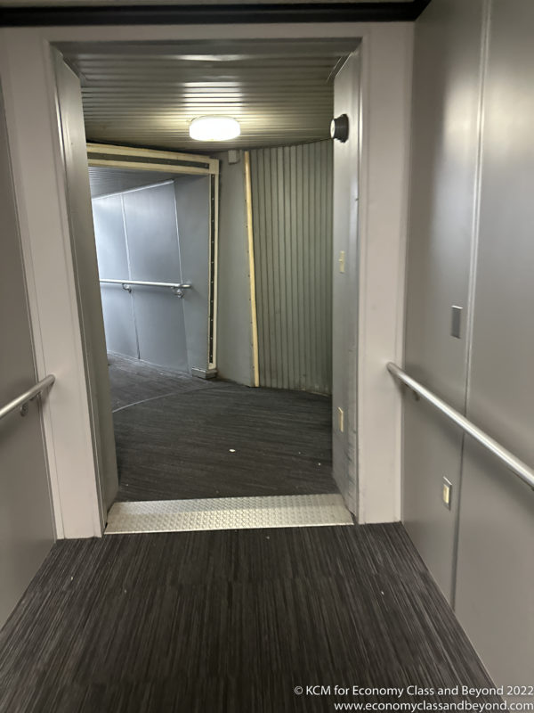 a hallway with a metal railing