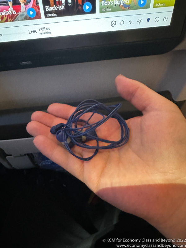 a hand holding a blue cord