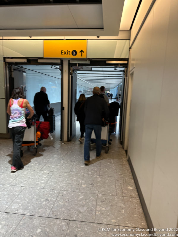 people walking through an airport