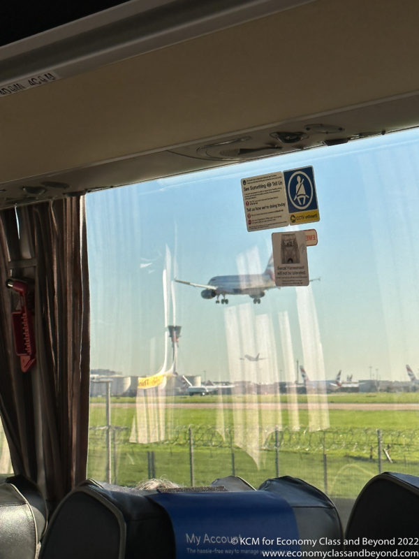 a plane taking off from a bus