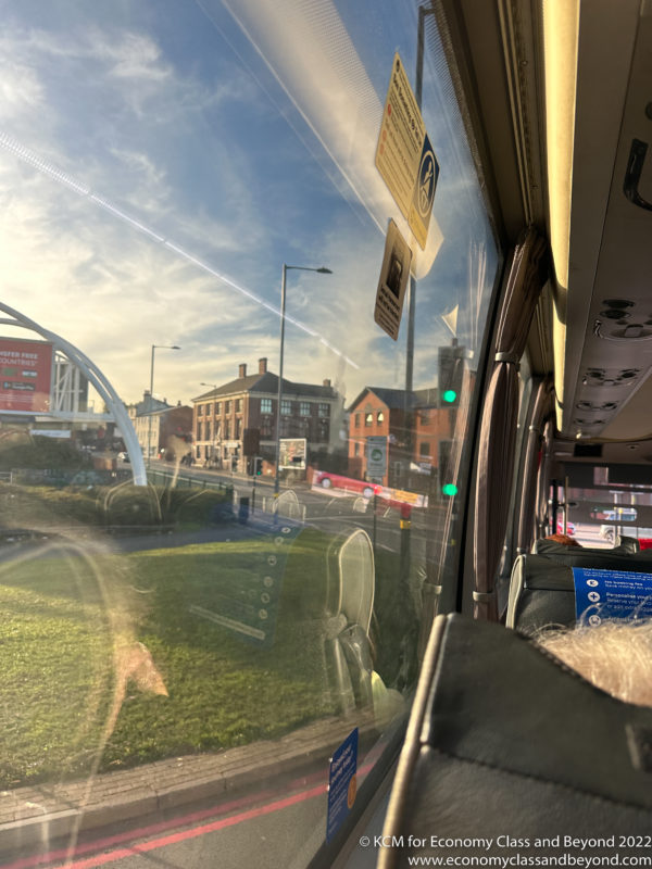 a view of a city from a bus window
