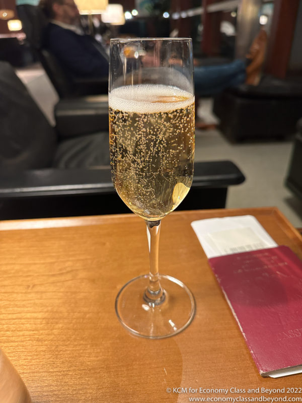 a glass of champagne on a table