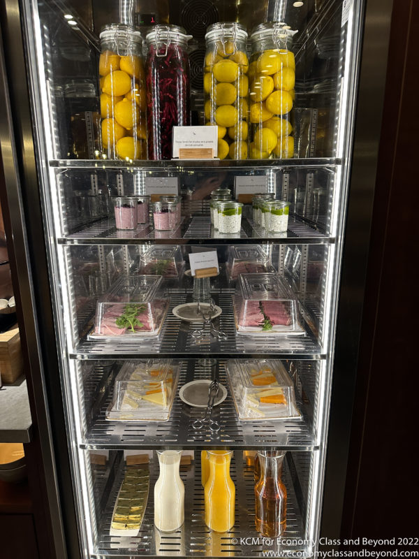 a refrigerator with food on shelves