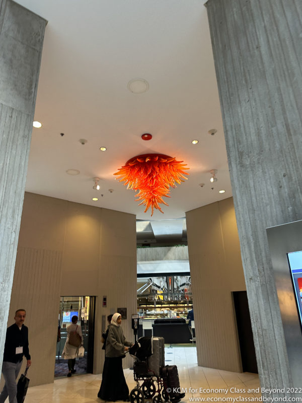 a large orange chandelier in a building
