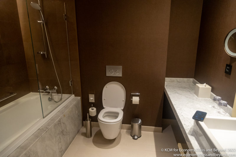 a bathroom with a toilet and tub