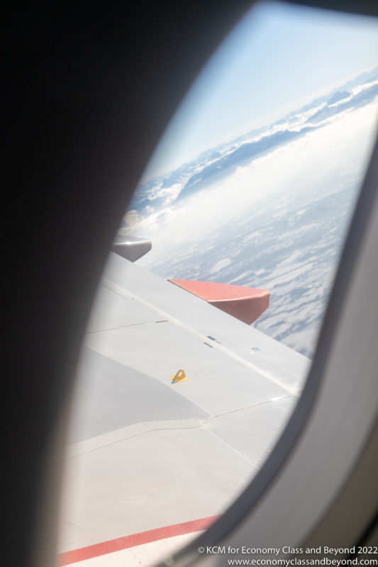 a view of the wing of an airplane from the window of an airplane
