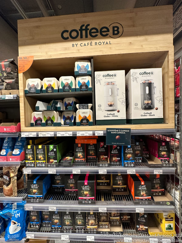 a shelf with coffee bags and boxes on it