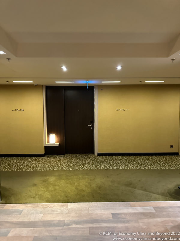 a room with a door and a carpet