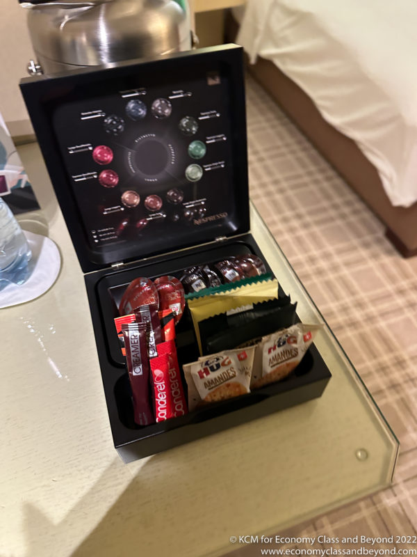 a small black box with a variety of snacks inside