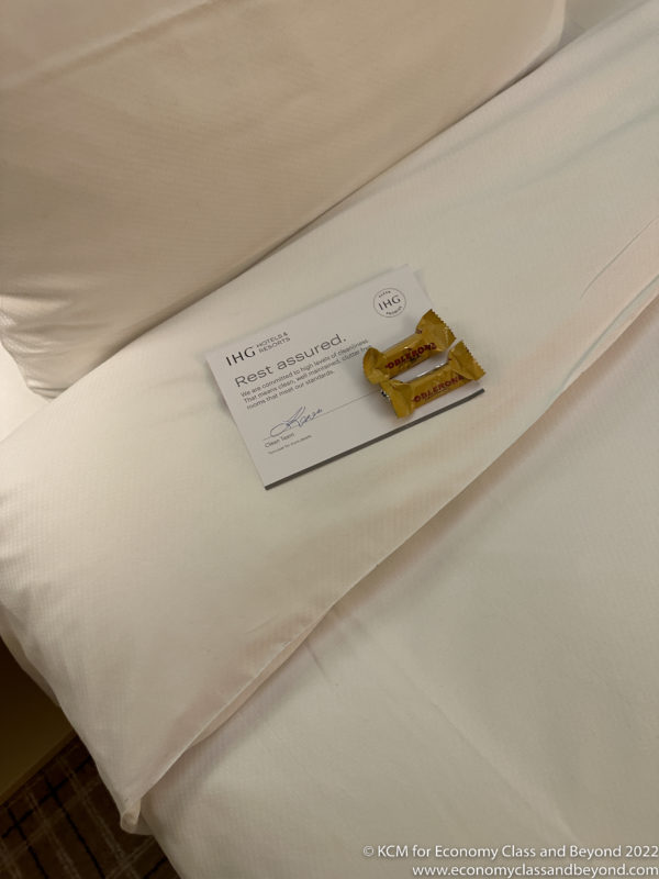 a package of candy on a bed