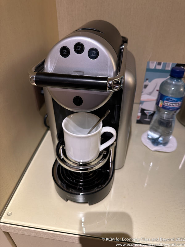 a coffee maker with a cup in it