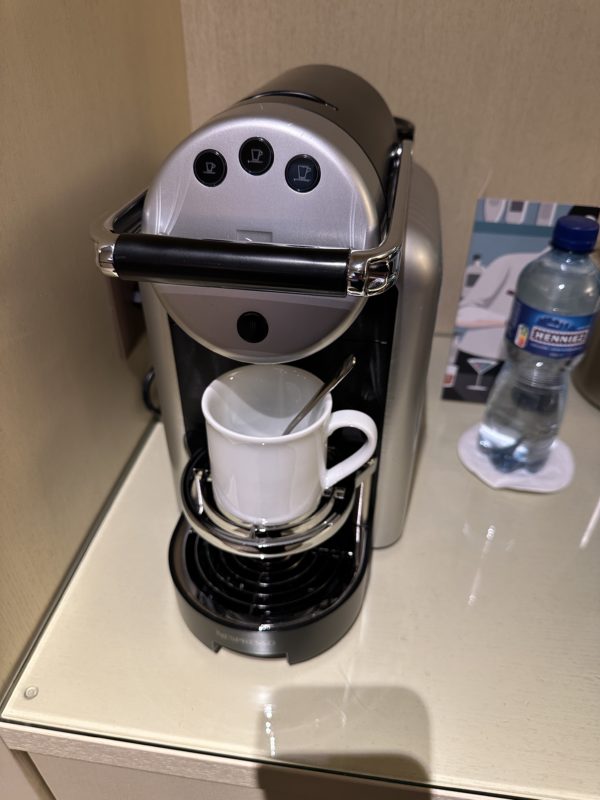 a coffee maker with a cup in it