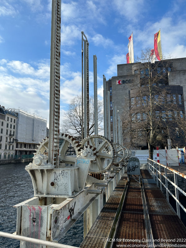 a large metal machine on a bridge