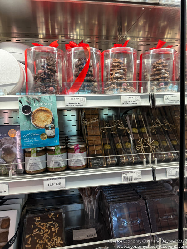 a shelf with various chocolates and cookies