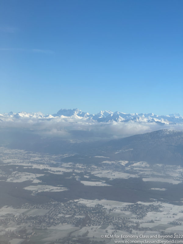 a landscape with snow covered mountains