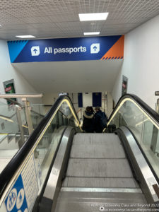 people on an escalator in a building