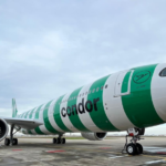 a green and white airplane