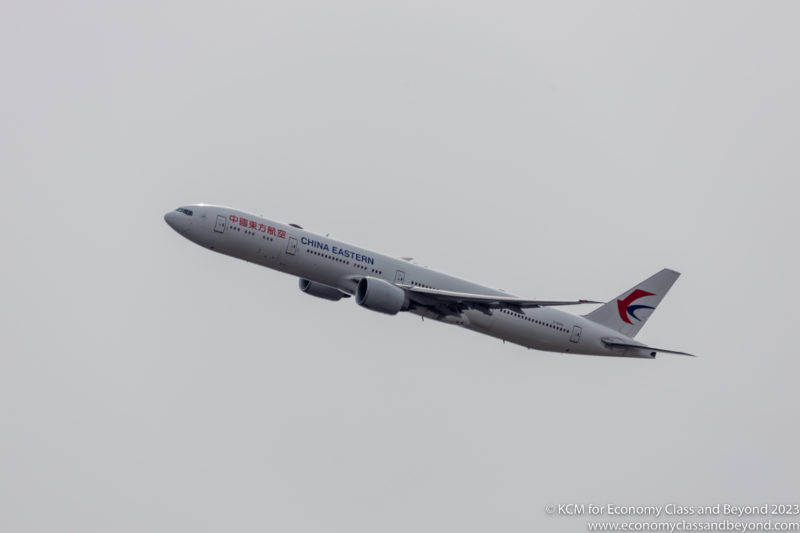 China Eastern Airlines Boeing 777-300ER climbing out of Chicago O'Hare - Image, Economy Class and Beyond