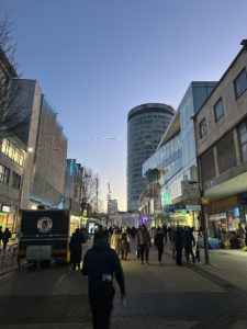 a group of people walking down a street