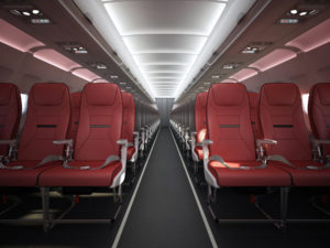 a row of red seats in an airplane