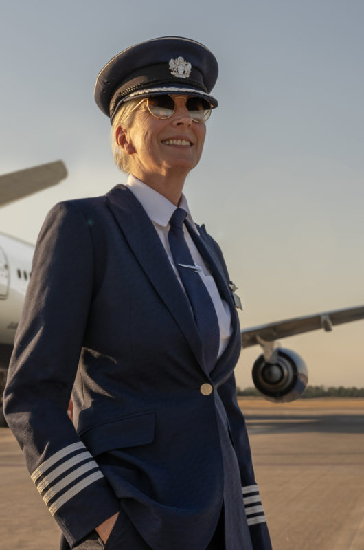 a woman in a uniform and hat