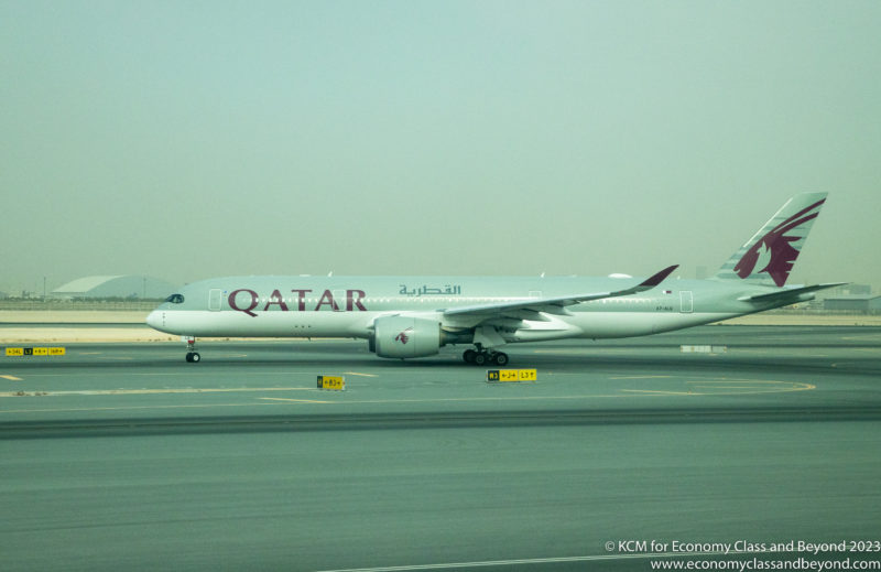 Qatar Airways Airbus A350-900 taxiing at Hamad International Airport, Doha. Image, Economy Class and Beyond
