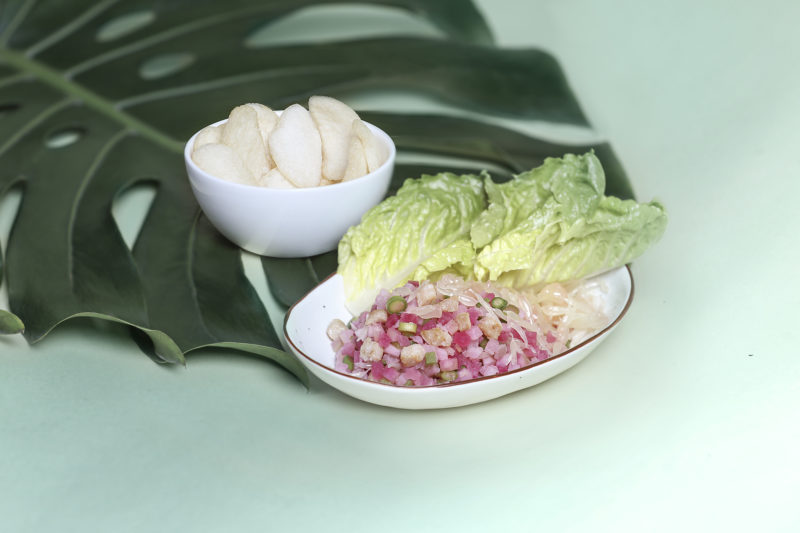 a bowl of food and a bowl of food on a leaf