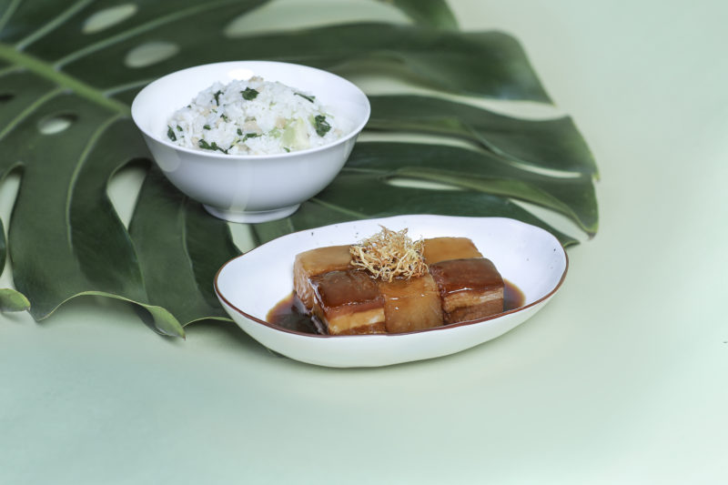 a plate of food and a bowl of rice