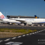 a large white airplane on a runway