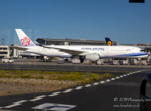 a large white airplane on a runway
