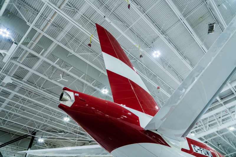 the tail of a plane in a hangar