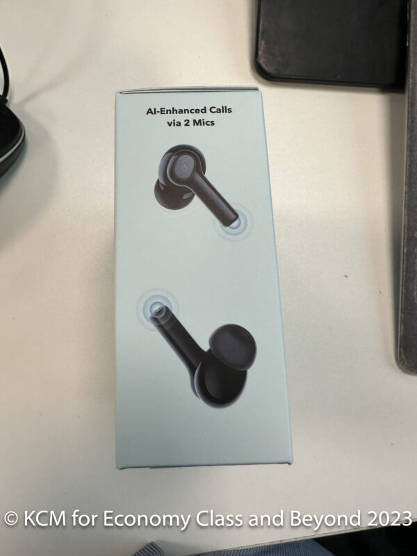 a box with a picture of a pair of black earbuds