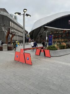 a red barrier in front of a building