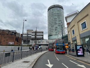 a double decker buses on a street in a city