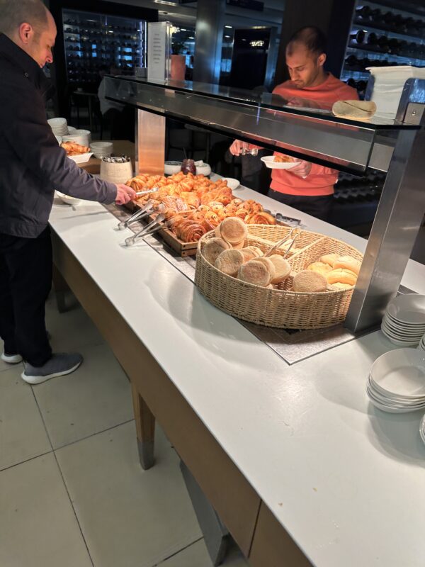 a person standing at a buffet