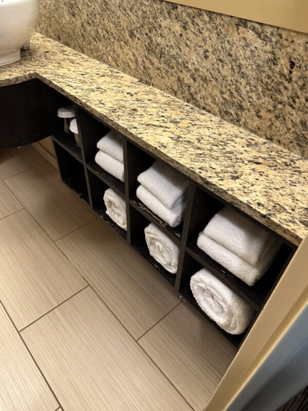 a shelf with towels on it