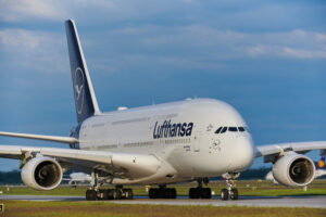 a large white airplane on a runway