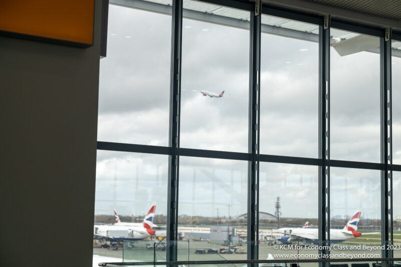 a plane flying through a window