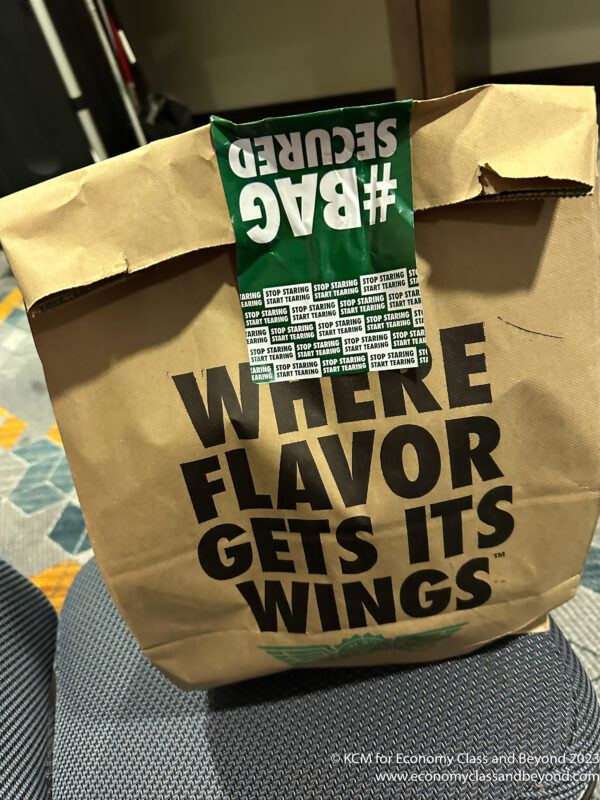 a brown bag with black text on it