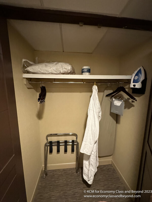 a white robe on a shelf in a room