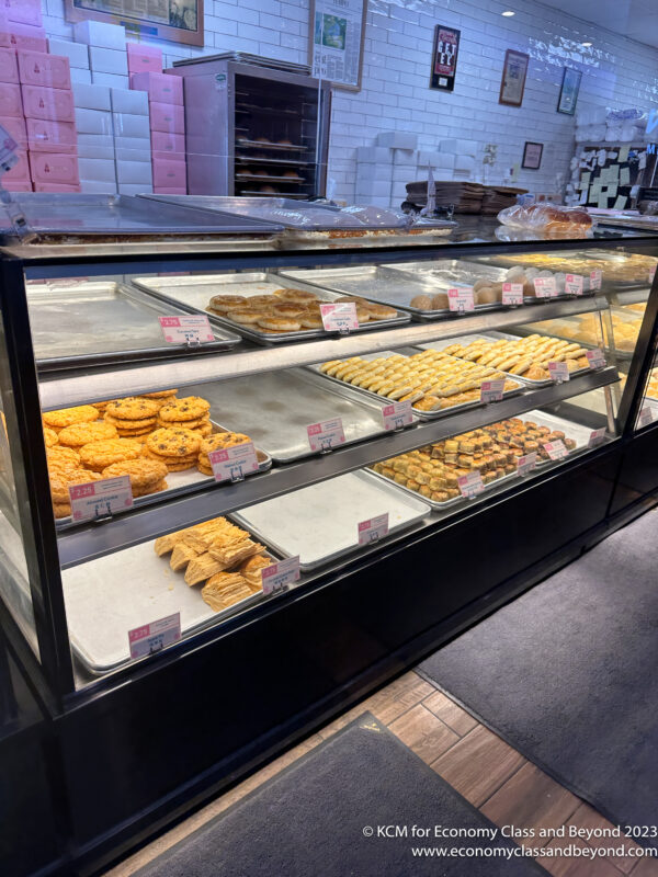 a display case with trays of cookies