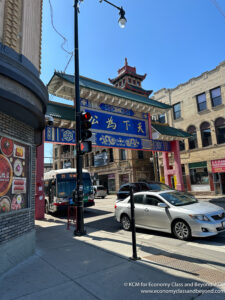 a street with cars and a sign on it
