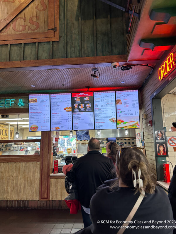 a group of people looking at menus
